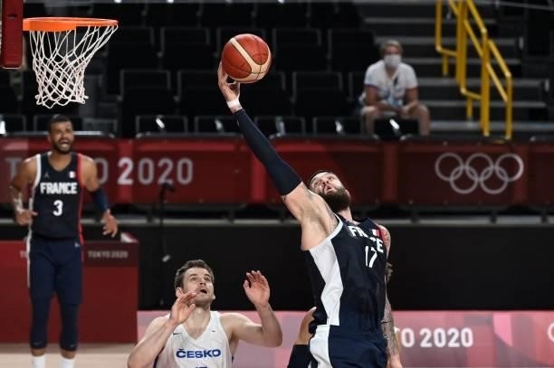 France's Vincent Poirier jumps for the ball next to Czech Republic's Jaromir Bohacik in the men's preliminary round group A basketball match between...
