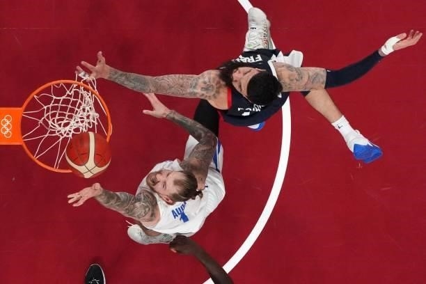 France's Vincent Poirier and Czech Republic's Patrik Auda fight for the rebound in the men's preliminary round group A basketball match between...