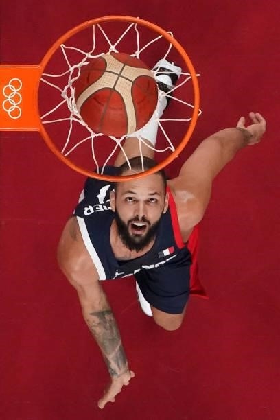 France's Evan Fournier scores a basket in the men's preliminary round group A basketball match between France and Czech Republic during the Tokyo...