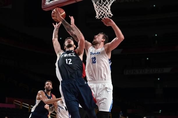 France's Nando De Colo goes to the basket past Czech Republic's Ondrej Balvin in the men's preliminary round group A basketball match between France...