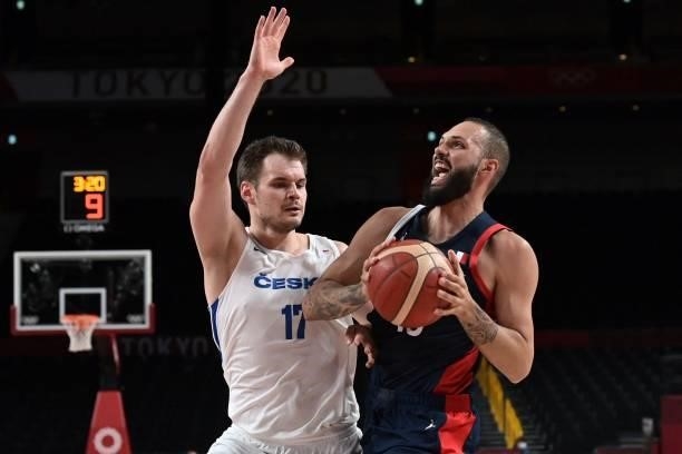 France's Evan Fournier and Czech Republic's Jaromir Bohacik fight for the ball in the men's preliminary round group A basketball match between France...