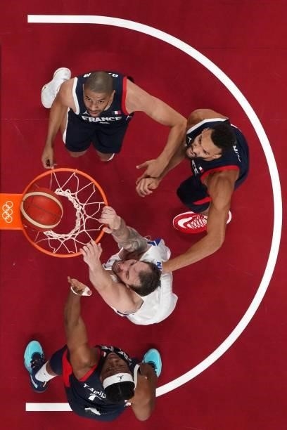 Czech Republic's Ondrej Balvin , France's Rudy Gobert and Nicolas Batum look at the basket in the men's preliminary round group A basketball match...