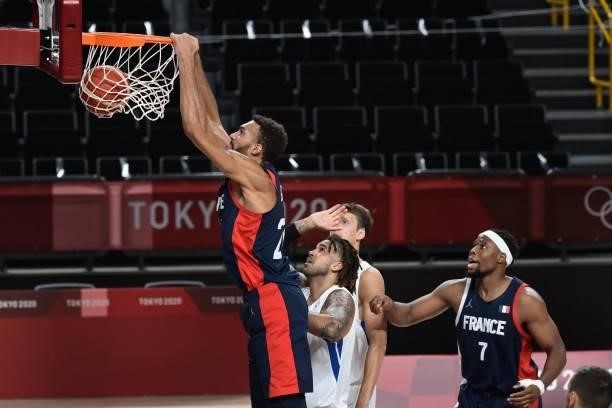 France's Rudy Gobert goes for a dunk past Czech Republic's Blake Schilb in the men's preliminary round group A basketball match between France and...