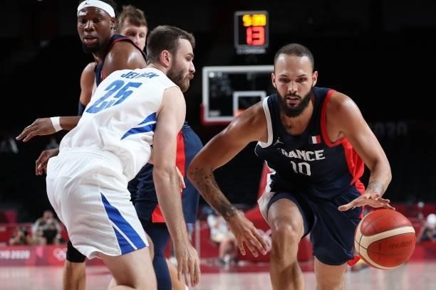 France's Evan Fournier dribbles the ball past Czech Republic's David Jelinek in the men's preliminary round group A basketball match between France...
