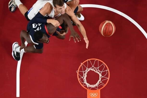 France's Moustapha Fall and Czech Republic's Jakub Sirina in the men's preliminary round group A basketball match between France and Czech Republic...