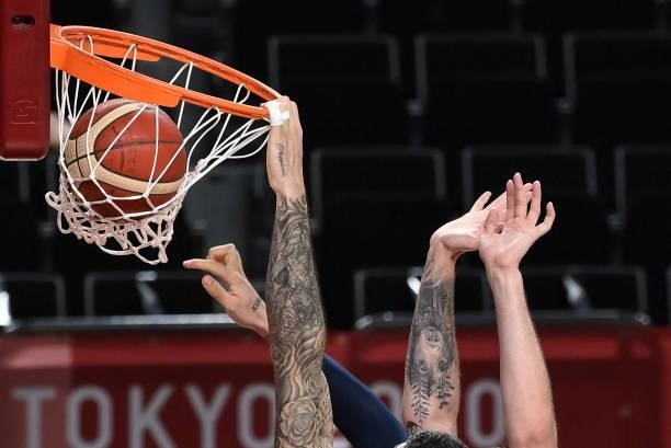 France's Vincent Poirier dunks the ball during the men's preliminary round group A basketball match between France and Czech Republic during the...