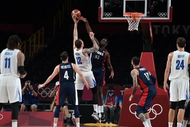 Czech Republic's Ondrej Balvin goes to the basket past France's Moustapha Fall in the men's preliminary round group A basketball match between France...