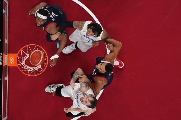Czech Republic's Ondrej Balvin , France's Rudy Gobert and Guerschon Yabusele look at the basket in the men's preliminary round group A basketball...
