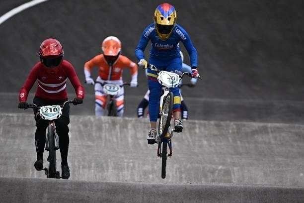 Denmark's Simone Christensen, Netherlands' Merel Smulders and Colombia's Mariana Pajon compete in the cycling BMX racing women's quarter-finals run...