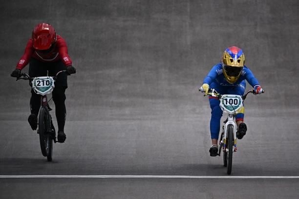 Denmark's Simone Christensen and Colombia's Mariana Pajon compete in the cycling BMX racing women's quarter-finals run at the Ariake Urban Sports...