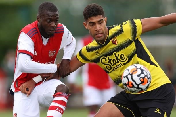 Pepe of Arsenal and Adam Masina of Watford during the Pre-Season Friendly between Arsenal and Watford at London Colney on July 28, 2021 in St Albans,...