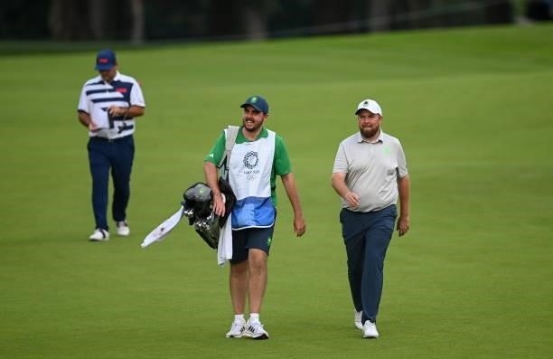 Tokyo , Japan - 29 July 2021; Shane Lowry of Ireland and caddy Alan Lowry walk the 18th during round 1 of the men's individual stroke play at the...