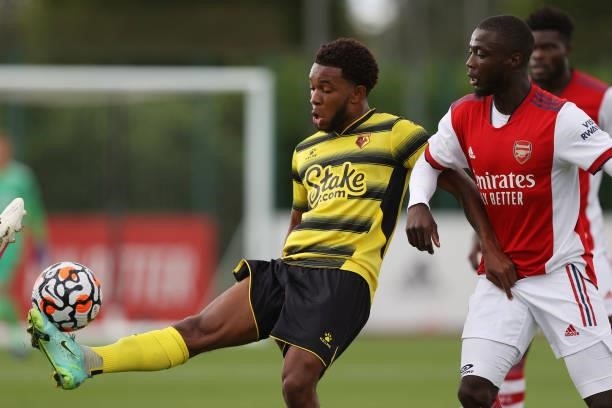 Kane Crichlow of Watford and Pepe of Arsenal during the Pre-Season Friendly between Arsenal and Watford at London Colney on July 28, 2021 in St...