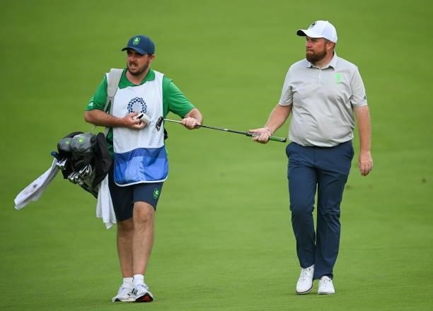 Tokyo , Japan - 29 July 2021; Shane Lowry of Ireland and caddy Alan Lowry walk the 18th during round 1 of the men's individual stroke play at the...