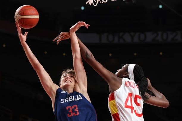 Serbia's Tina Krajisnik goes to the basket as Spain's Astou Ndour tries to block in the women's preliminary round group A basketball match between...