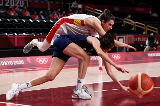 Serbia's Sonja Vasic and Spain's Alba Torrens run for the ball in the women's preliminary round group A basketball match between Spain and Serbia...