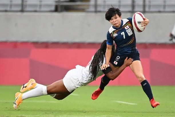 Japan's Wakaba Hara is tackled by USA's Ariana Ramsey during the women's pool C rugby sevens match between the USA and Japan during the Tokyo 2020...