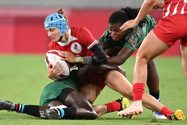 Russia's Elena Zdrokova is tackled during the women's pool A rugby sevens match between the Russia and Kenya during the Tokyo 2020 Olympic Games at...