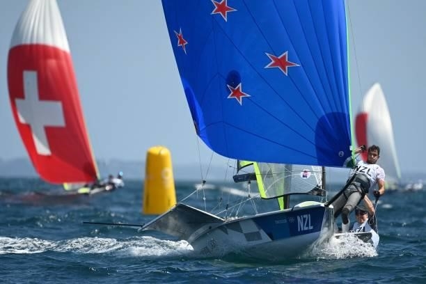 New Zealands Blair Tuke and Peter Burling compete in the men's skiff 49er race during the Tokyo 2020 Olympic Games sailing competition at the...