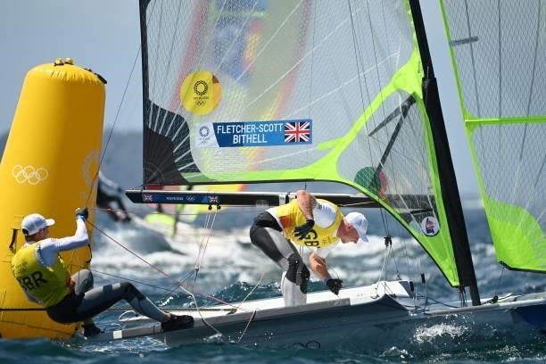 Britains Stuart Bithell and Dlan Fletcher-Scott take part in the men's skiff 49er race during the Tokyo 2020 Olympic Games sailing competition at the...