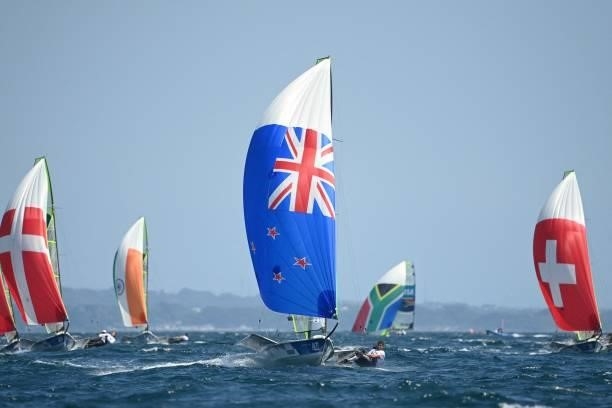 New Zealands Blair Tuke and Peter Burling compete in the men's skiff 49er race during the Tokyo 2020 Olympic Games sailing competition at the...