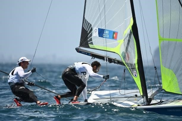 Portugals José Costa and Jorge Lime take part in the men's skiff 49er race during the Tokyo 2020 Olympic Games sailing competition at the Enoshima...