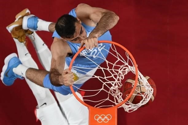 Argentina's Juan Pablo Vaulet goes for a dunk during the men's preliminary round group C basketball match between Spain and Argentina of the Tokyo...