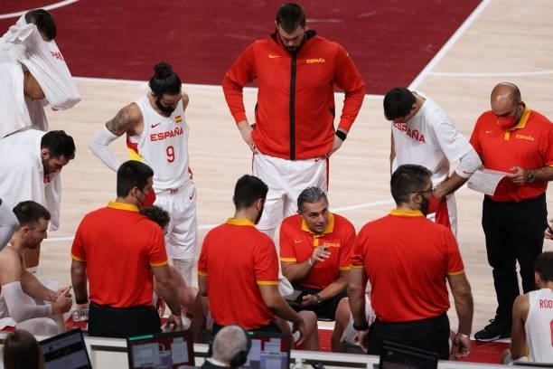 Spain's team coach Sergio Scariolo speaks to his players in the men's preliminary round group C basketball match between Spain and Argentina during...