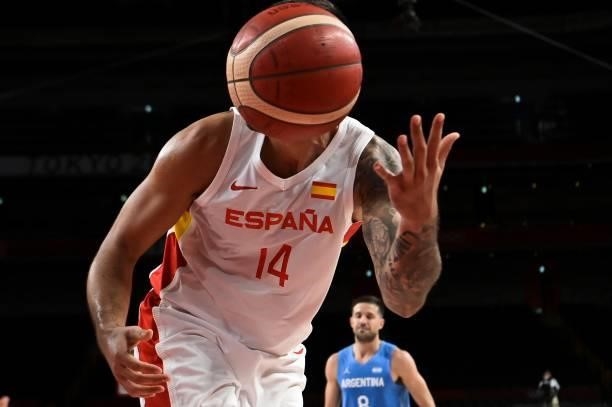 Spain's Willy Hernangomez Geuer vies for the ball during the men's preliminary round group C basketball match between Spain and Argentina of the...