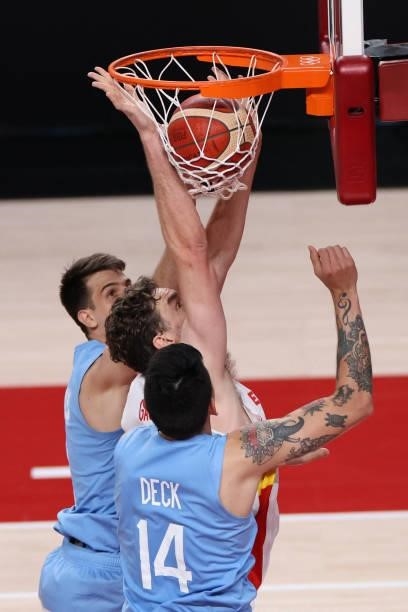 Spain's Pau Gasol Saez scores a basket as Argentina's Gabriel Deck tries to block in the men's preliminary round group C basketball match between...