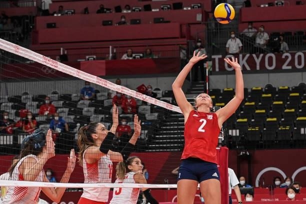 S Jordyn Poulter hits the ball in the women's preliminary round pool B volleyball match between USA and Turkey during the Tokyo 2020 Olympic Games at...