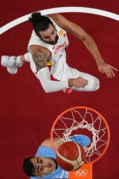 Spain's Ricky Rubio goes to the basket past Argentina's Juan Pablo Vaulet during the men's preliminary round group C basketball match between Spain...