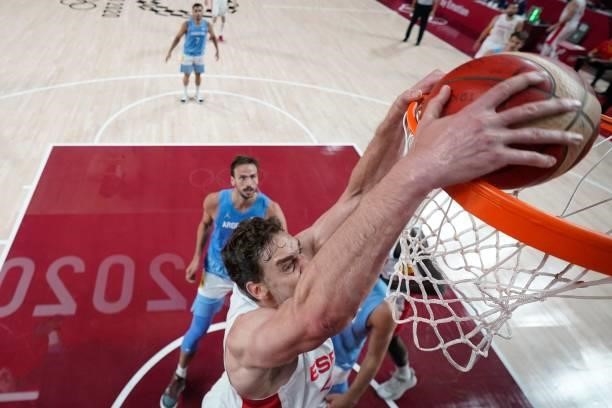 Spain's Pau Gasol Saez goes for a dunk during the men's preliminary round group C basketball match between Spain and Argentina of the Tokyo 2020...