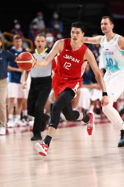 Yuta Watanabe of the Japan Men's National Team dribbles the ball against the Slovenia Men's National Team during the 2020 Tokyo Olympics at the...