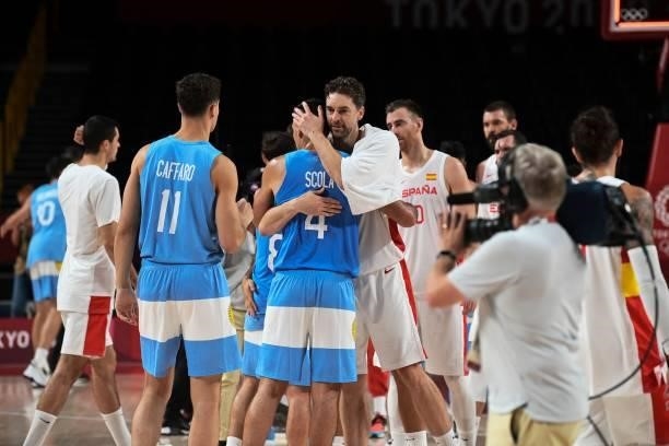Argentina's Luis Scola and Spain's Pau Gasol Saez embrace at the end of the men's preliminary round group C basketball match between Spain and...