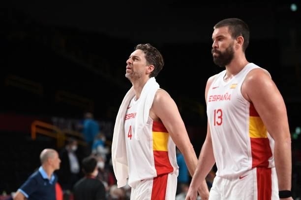 Spain's Pau Gasol Saez and Marc Gasol walk on the court after their victory at the end of the men's preliminary round group C basketball match...
