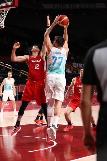 Yuta Watanabe of the Japan Men's National Team plays defense on Luka Doncic of the Slovenia Men's National Team during the 2020 Tokyo Olympics at the...