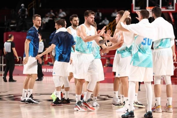 The Slovenia Men's National Team high five after the game against the Japan Men's National Team during the 2020 Tokyo Olympics at the Saitama Super...