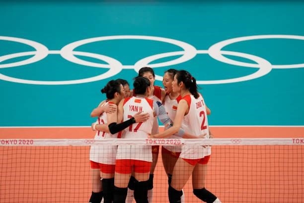 Playersof China celebrate a point during the Women's Preliminary - Pool B volleyball match between China and ROC on day six of the Tokyo 2020 Olympic...