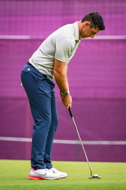 Rory McIlroy of Team Ireland taps in his par putt with his Scotty Cameron putter on the 16th hole green during the first round of Mens Individual...