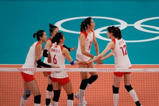 Players of China celebrate a point during the Women's Preliminary - Pool B volleyball match between China and ROC on day six of the Tokyo 2020...