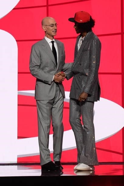 Jalen Green shakes hands with NBA Commissioner Adam Silver after being selected number two overallby the Houston Rockets during the 2021 NBA Draft on...