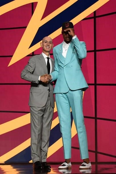 Evan Mobley shakes hands with NBA Commissioner Adam Silver after being selected number three overall by the Cleveland Cavaliers during the 2021 NBA...