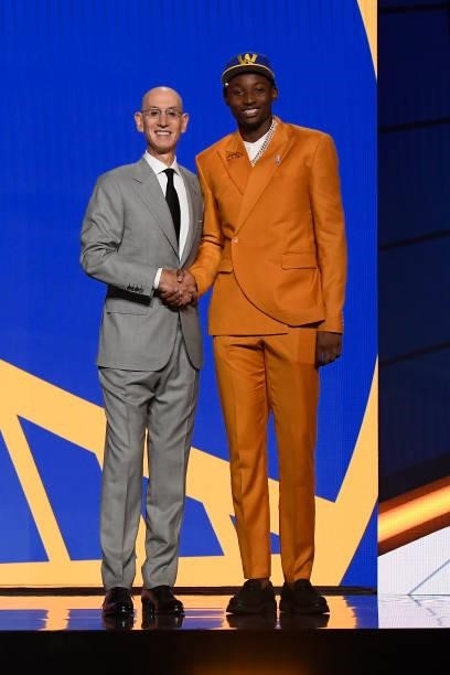 Jonathan Kuminga shakes hands with NBA Commissioner Adam Silver after being selected number seven overall by the Golden State Warriors during the...
