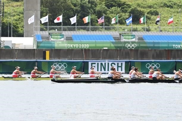Canada's boat crosses the finish line first to win the gold medal in the women's eight final during the Tokyo 2020 Olympic Games at the Sea Forest...