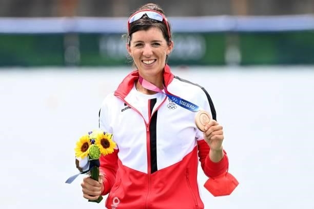 Bronze medalist Austria's Magdalena Lobnig poses on the podium following the women's single sculls final during the Tokyo 2020 Olympic Games at the...