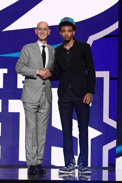 James Bouknight shakes hands with NBA Commissioner Adam Silver after being selected number eleven overall by the Charlotte Hornets during the 2021...