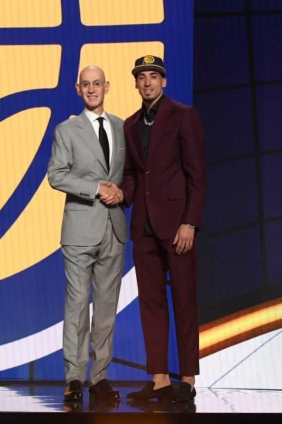 Chris Duarte shakes hands with NBA Commissioner Adam Silver after being selected number thirteen overall by the Indiana Pacers during the 2021 NBA...