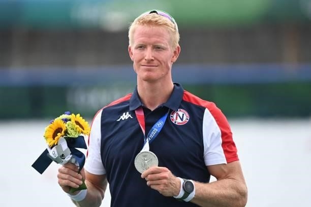 Silver medalist Norway's Kjetil Borch poses on the podium following the men's single sculls final during the Tokyo 2020 Olympic Games at the Sea...