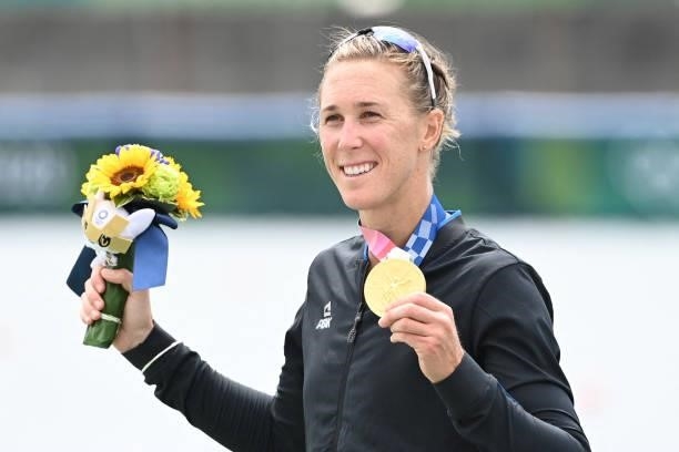 Gold medalist New Zealand's Emma Twigg poses on the podium following the women's single sculls final during the Tokyo 2020 Olympic Games at the Sea...